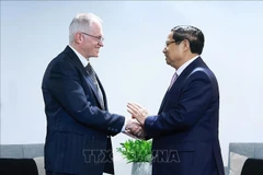 越南政府总理范明政会见南非工商会副主席尼尔·波洛克。图自越通社