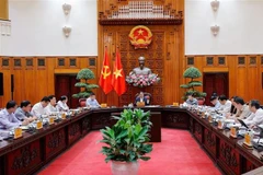 越南政府总理范明政主持召开政府常务委员会会议。图自越通社