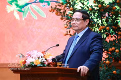 越南政府总理范明政发表讲话。图自越通社