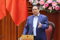 越南政府总理范明政发表讲话。图自越通社