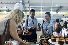 美国向越南消费者推销农产品。图自越通社