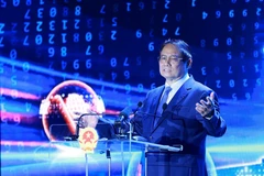越南政府总理范明政发表讲话。图自越通社