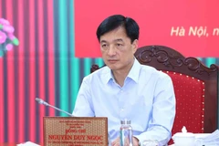 越共中央政治局委员、中央书记处书记、中央检查委员会主任阮维玉主持会议。图自越通社