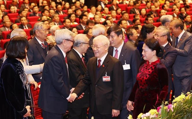 越共中央总书记、国家主席阮富仲、越共中央政治局委员、国会主席阮氏金银出席越共十三大开幕式。图自越通社