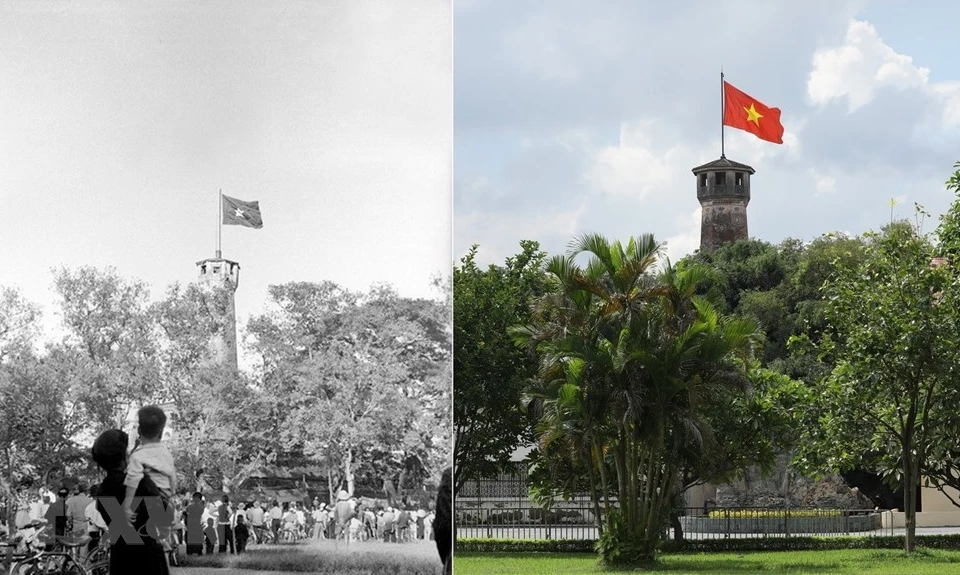 1954年10月10日，全国人民在首都解放日仰望着河内旗台上飘扬的金星红旗。图自越通社