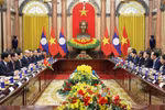 越南国家主席梁强会见老挝总书记、国家主席通伦·西苏里。图自越通社