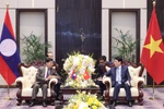 越南国家主席梁强会见老挝总书记、国家主席通伦·西苏里。图自越通社