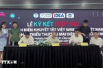 越南青年创业支持中心（SYS Vietnam）、越南工贸部电子商务和数字经济局下属的电子商务和数字技术发展中心（eComDX）与越南残疾青年协会在河内举行了全面合作计划签字仪式。图自越通社