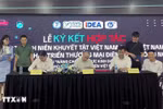 越南青年创业支持中心（SYS Vietnam）、越南工贸部电子商务和数字经济局下属的电子商务和数字技术发展中心（eComDX）与越南残疾青年协会在河内举行了全面合作计划签字仪式。图自越通社