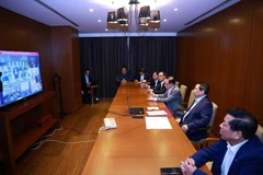 范明政总理与国内各省市举行视频会议，部署救援抢险及灾后恢复工作。图自 越通社