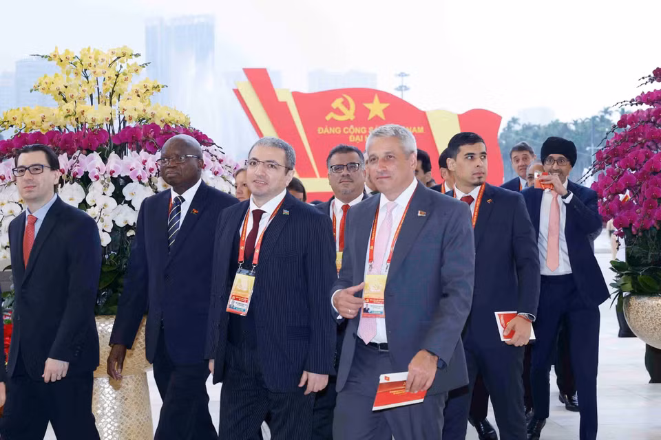 各国际代表出席越共十四大开幕式。图自越通社