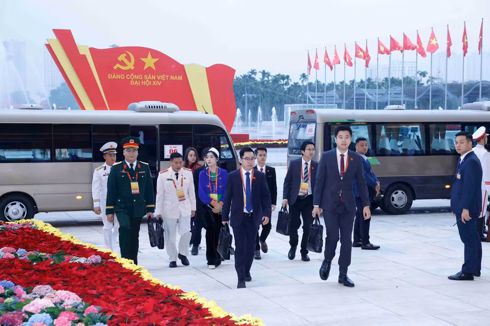 各位代表出席越共十四大开幕式。图自越通社