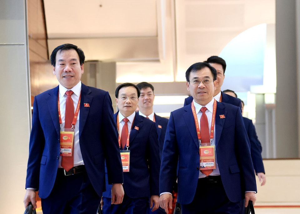 各位代表出席越共十四大开幕式。图自越通社