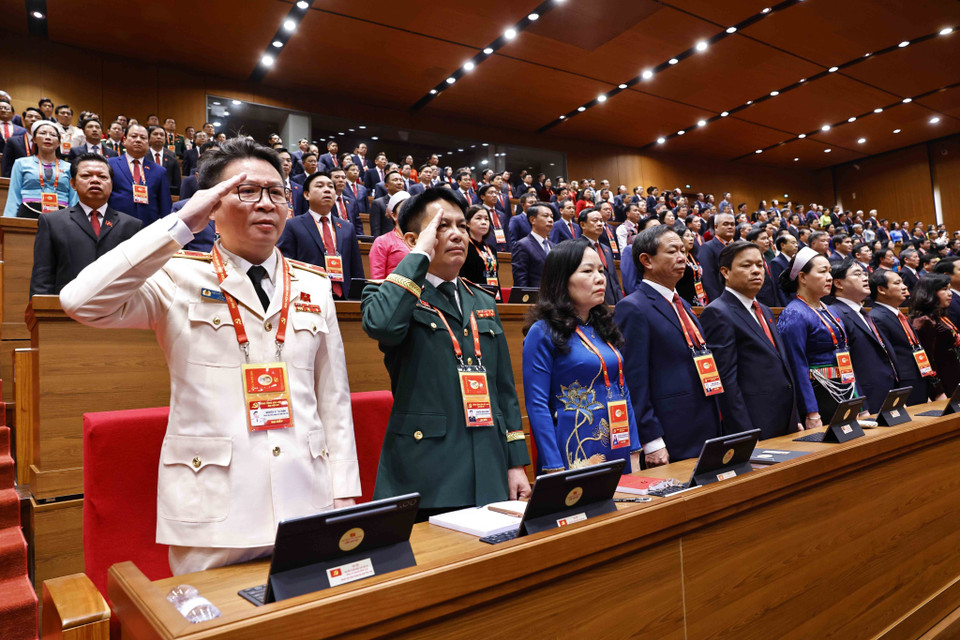 与会代表出席越共十四大开幕式。图自越通社