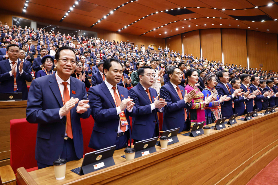 与会代表出席越共十四大开幕式。图自越通社
