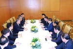 越南政府总理范明政与中国国务院总理李强举行会谈。图自越通社