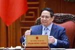 越南政府总理范明政在会议上发言。图自越通社