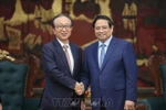 越南政府总理范明政会见日本三菱日联金融集团社长龟泽宏规。图自越通社