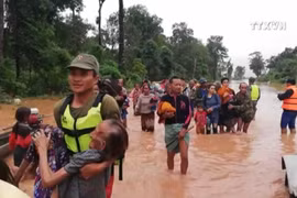 老挝一水电站大坝坍塌 越南领导人为此致慰问电