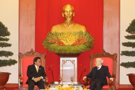越共中央总书记阮富仲与越南国家主席陈大光会见印尼地方代表理事会主席乌斯曼