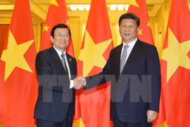 越南国家主席张晋创（左）2015年9月赴中国出席世界反法斯战争胜利70周年纪念典礼期间会见了中共中央总书记、国家主席习近平。