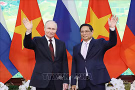 越南政府总理范明政与俄罗斯总统弗拉基米尔·普京。图自越通社