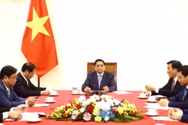 越南政府总理范明政同中国国务院总理李强通电话