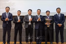 与会代表合影。图自越通社