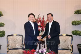 胡志明市领导会见中国全国党建研究会会长李智勇