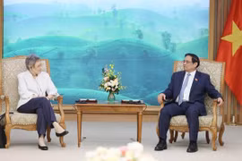 越南政府总理范明政建议法国支持越南预防新发传染病