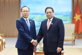 越南政府总理范明政会见离任前来拜会的柬埔寨驻越大使查伊
