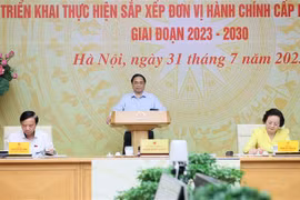 越南政府总理范明政主持召开全国县乡行政单位设置工作视频会议