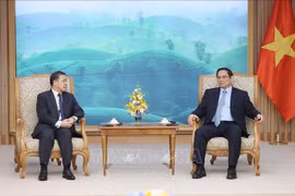 越南政府总理范明政会见即将届满离任的老挝驻越南大使森菲特•洪邦光