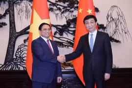 越南政府总理范明政会见中共中央政治局常委、全国政协主席王沪宁