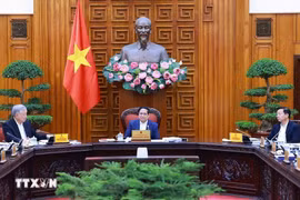 政府总理范明政主持召开政府落实第18号决议指导委员会第二次会议。图自越通社