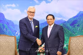 政府总理范明政会见前来拜别的德国驻越南大使吉多·希尔德纳。图自越通社