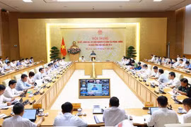 范明政主持会议。图自越通社