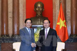 越南国家主席陈大光会见中国驻越大使洪小勇。