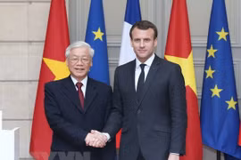 越共中央总书记阮富仲与法国总统埃马纽埃尔·马克龙。（图片来源：越通社）