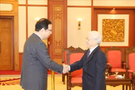越共中央总书记、国家主席阮富仲会见日本共产党代表团
