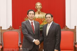 越共中央组织部部长范明正会见日本共产党代表团