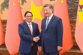 越南政府总理范明政会见中共中央总书记、国家主席习近平
