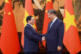  越南政府总理范明政会见中共中央总书记、中国国家主席习近平。图自越通社