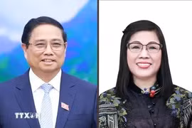 政府范明政和夫人。图自越通社