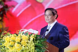 越南政府总理范明政发表讲话。图自越通社