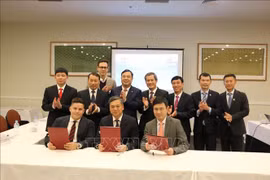 签署仪式场景。图自越通社