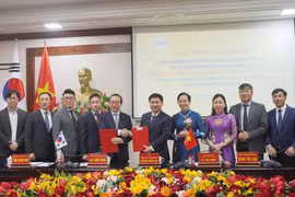 谅解备忘绿签署仪式。图自越通社