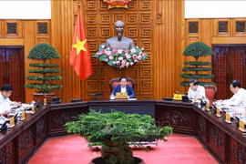 政府总理范明政主持召开会议。图自越通社