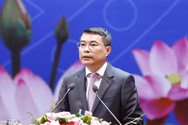 越南国家银行行长黎明兴在会上发表讲话。（图片来源：越通社）