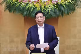 越南政府总理范明政同越南国家银行举行工作会议